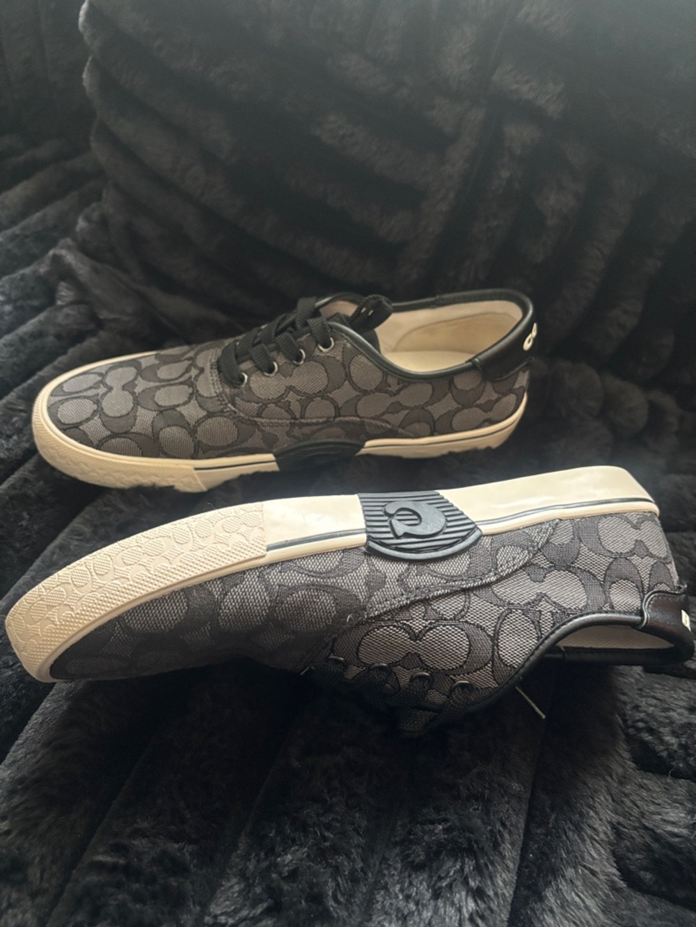 Coach Women’s Gray Signature Logo Low-Top Sneakers with Black Trim.